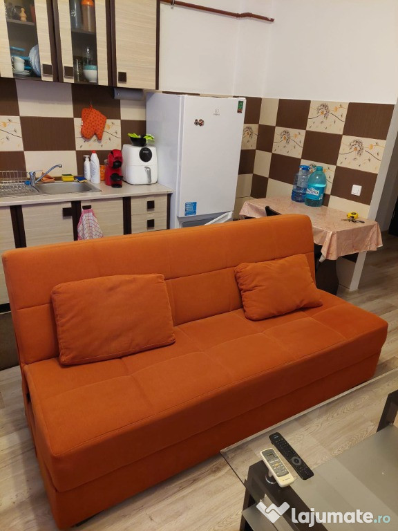 Vand canapea extensibila portocalie perfecta stare