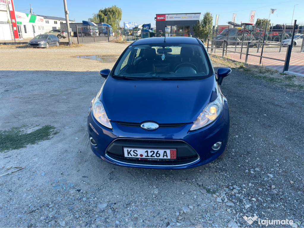 Ford fiesta 1,25 ghia, navigație, klima, geamuri electrice