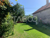 Casa de vanzare 3 camere 90 mpu teren liber 1095 mp Persani