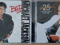 Două cd-uri cu muzică, Michael Jackson Thriller și Bad