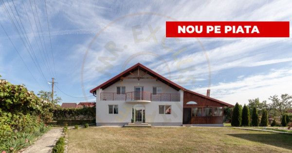 Casa cu teren generos si gradina spectaculoasa – comuna cu