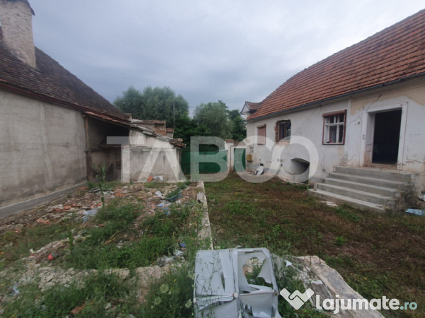 Casa de vanzare in grid 87 mp utili + anexe beci si sura